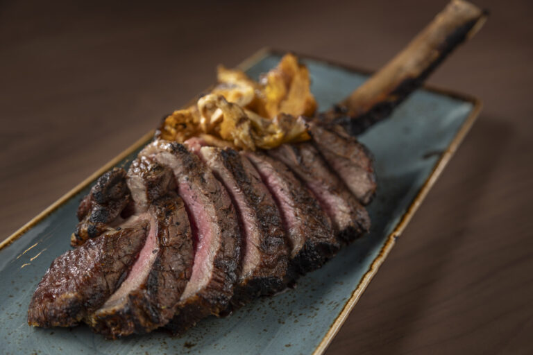 Tomahawk Steak dish served at the Hunters Club, Prairie Knights Resort & Casino.